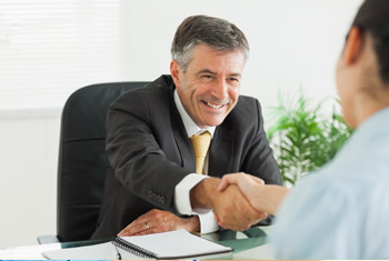 Image of a man shaking hands with someone