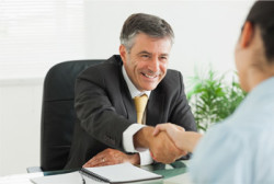 Image of a man shaking hands with someone