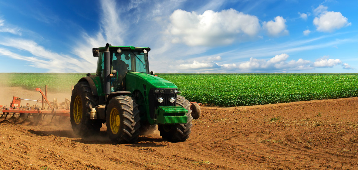 Image of a tractor being driven through a field