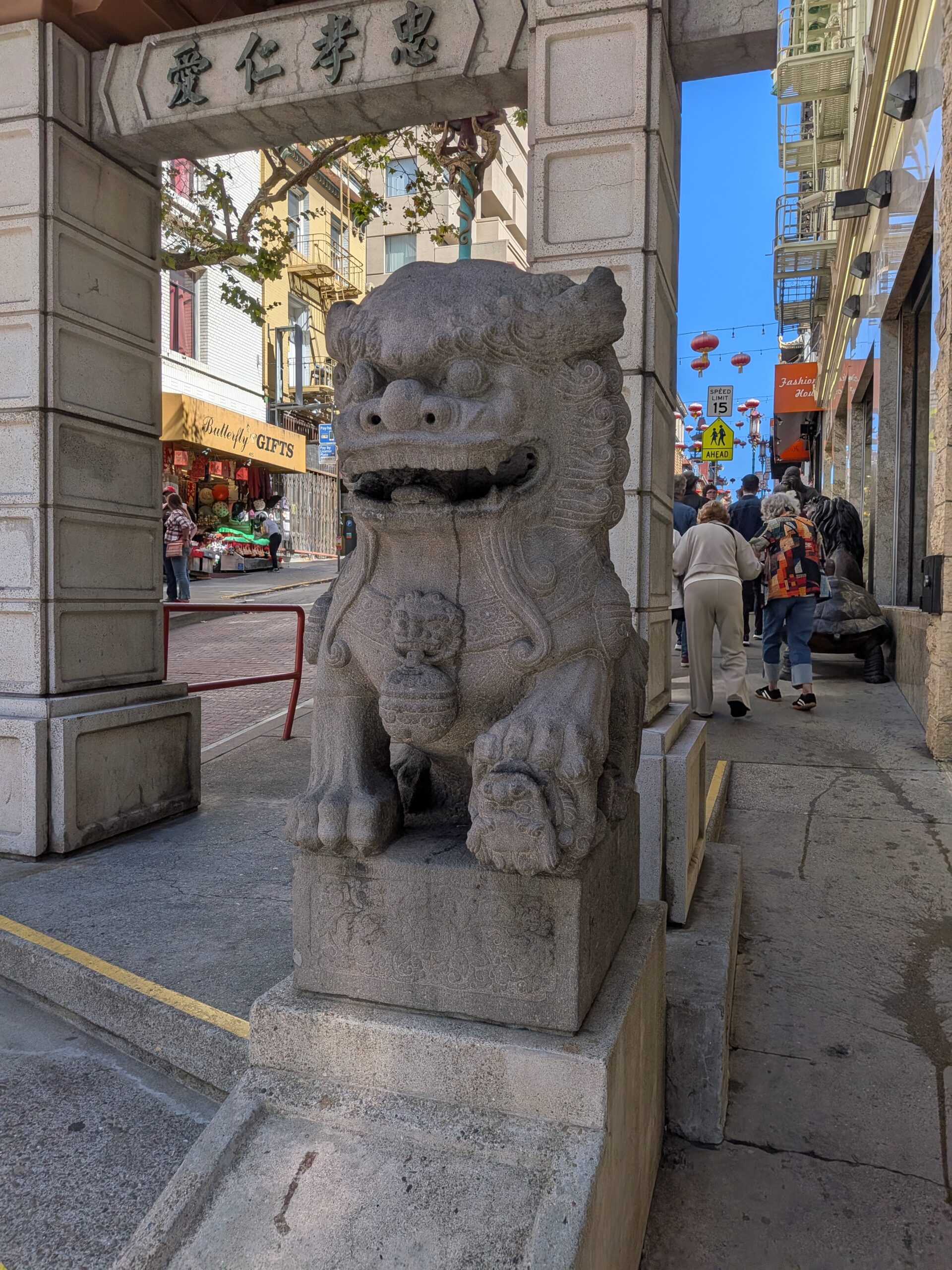 Female guardian lion beside Chinatown’s Dragon Gate